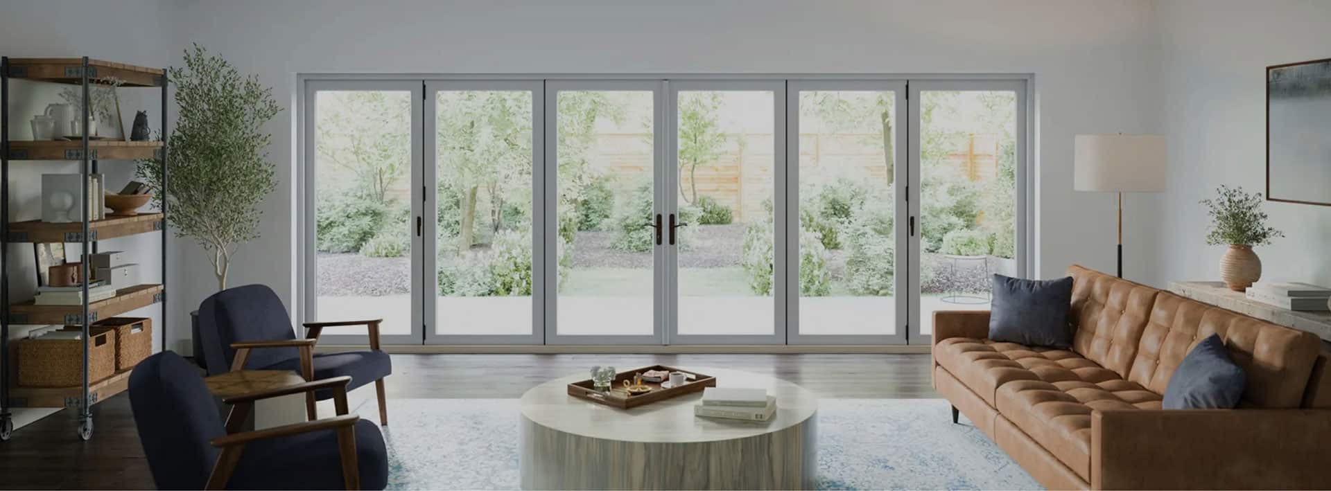 living room with large window and doors spanning the wall