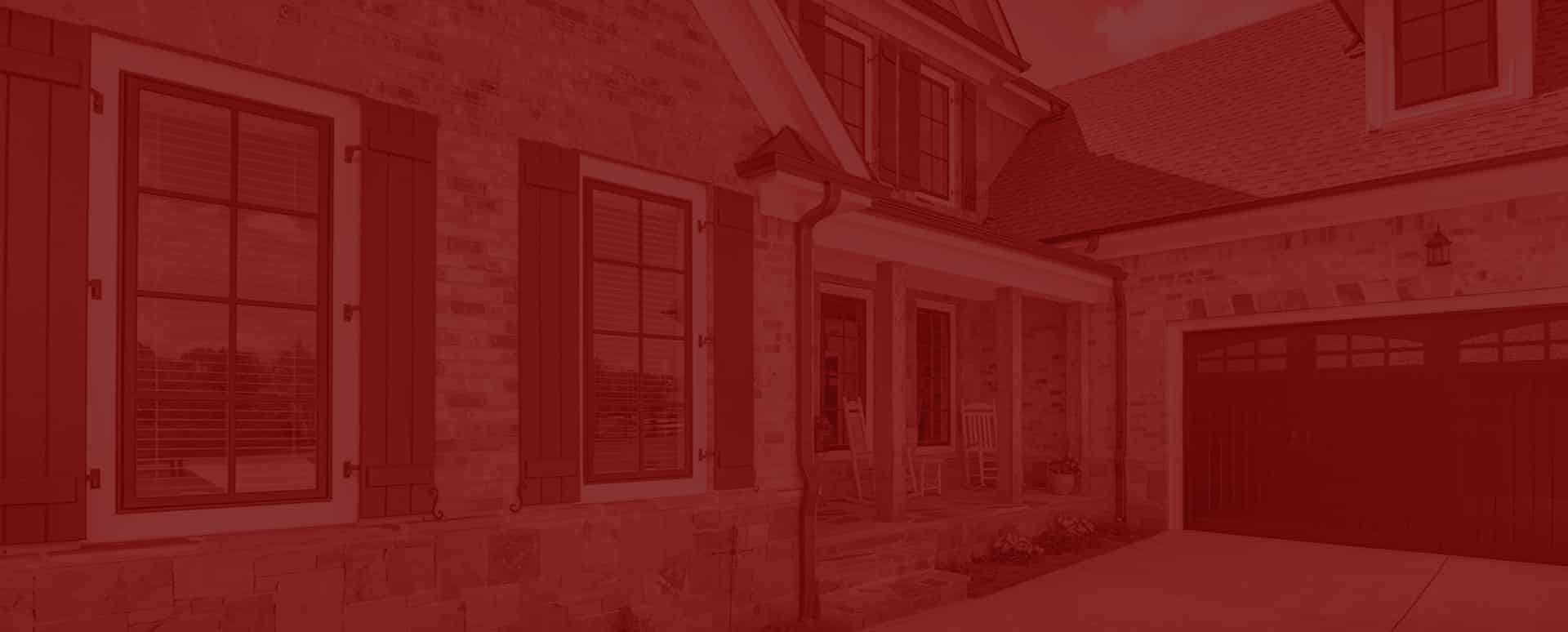 red overlayed image of house with windows and garge windows